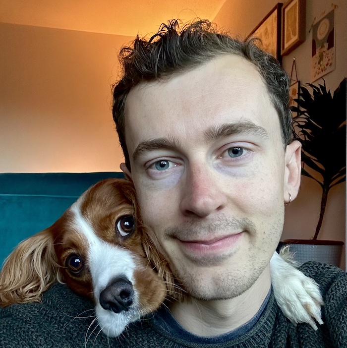 A photo of Andy with his dog, Rolo.